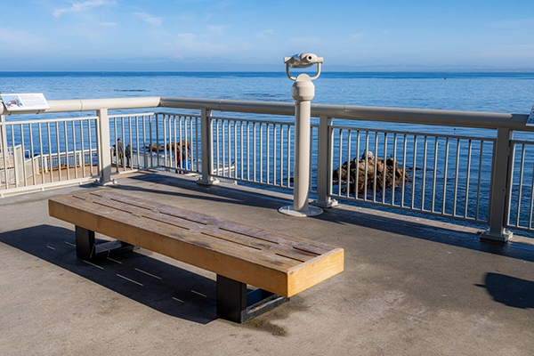 One of the Aquarium’s back viewing decks features a wooden bench, viewing scopes, and a beautiful view of Monterey Bay