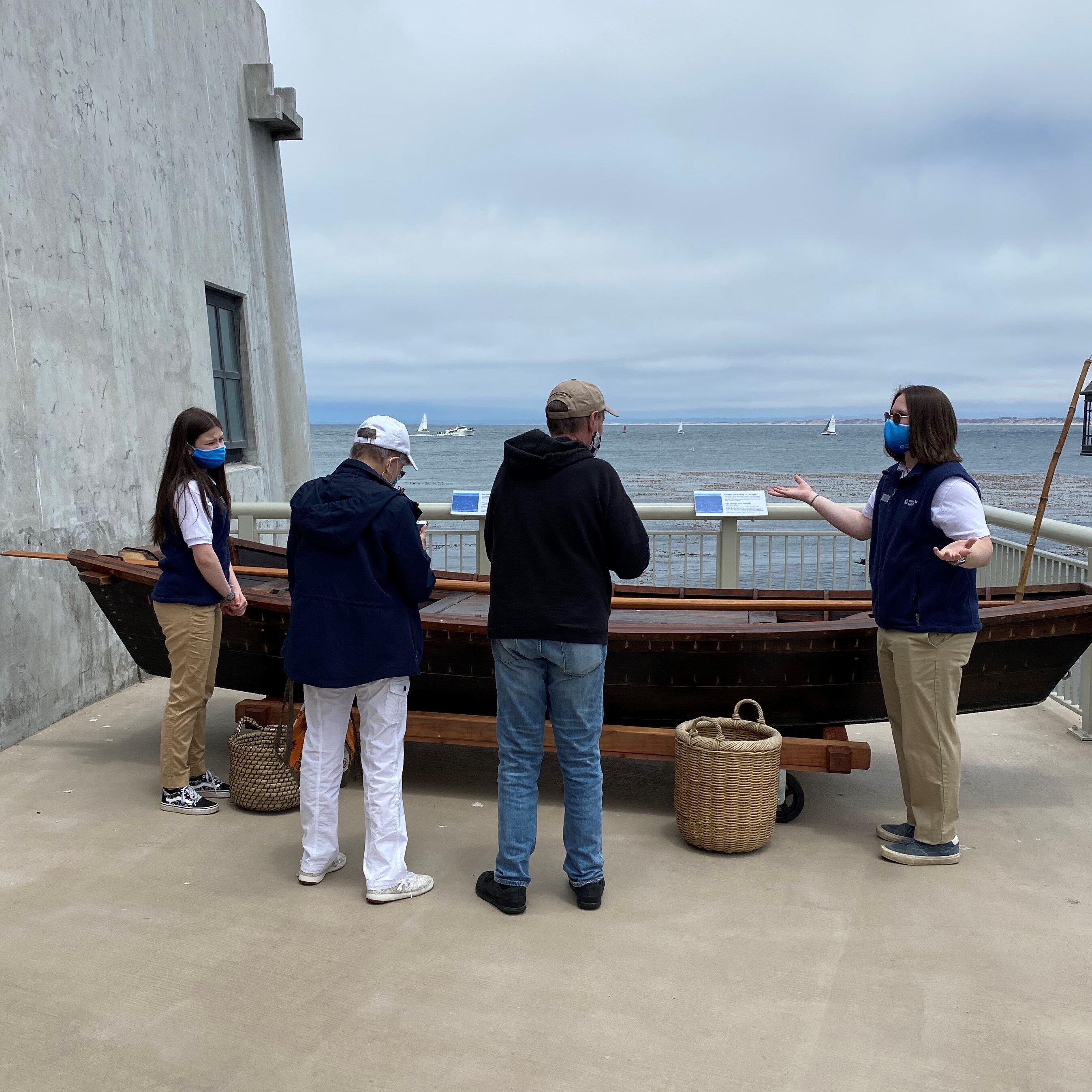 TCL teens interpreting Chinese sampan for guests on back deck - summer 2021