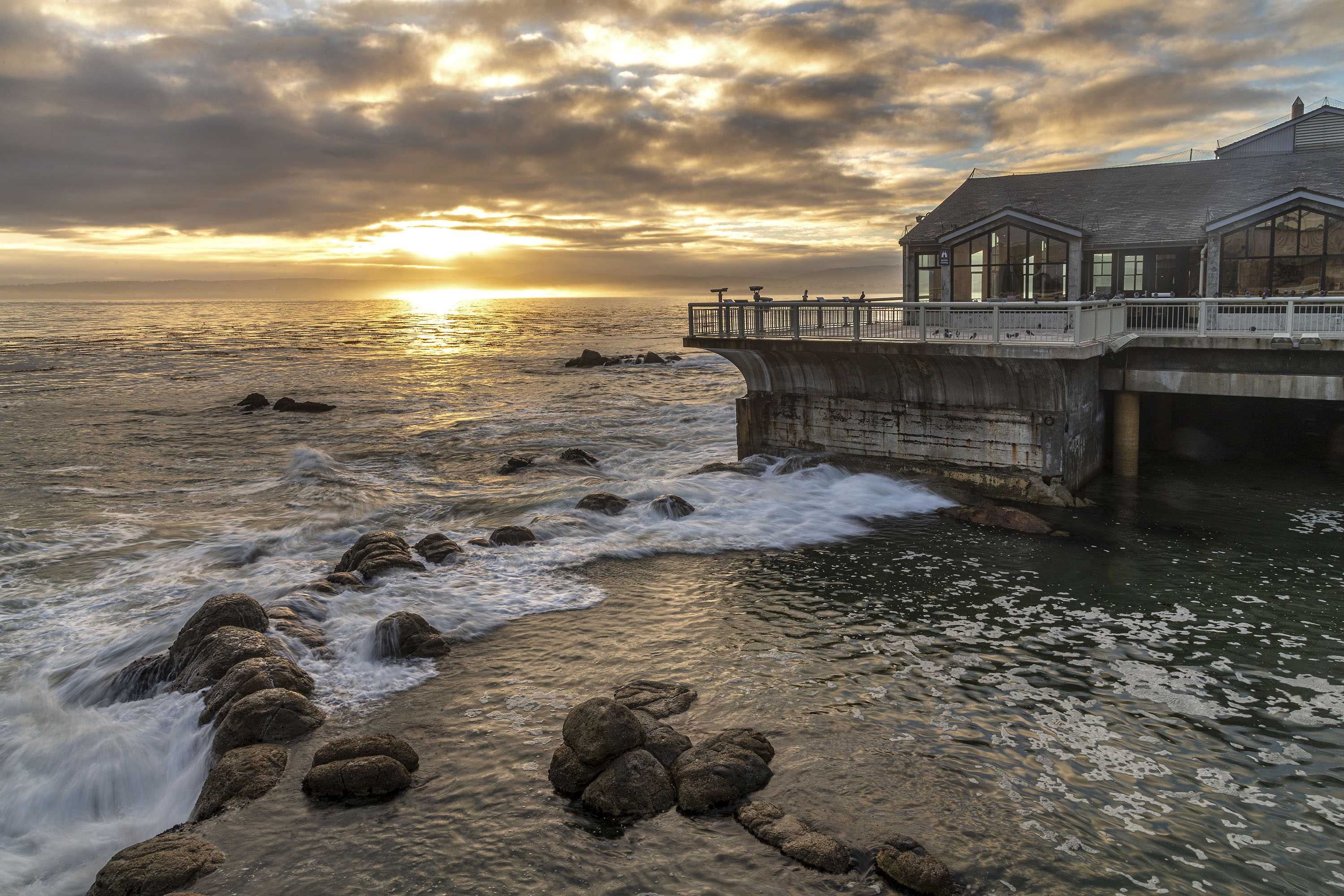 A stormy morning with powerful surf hitting the back deck of the Monterey Bay Aquarium