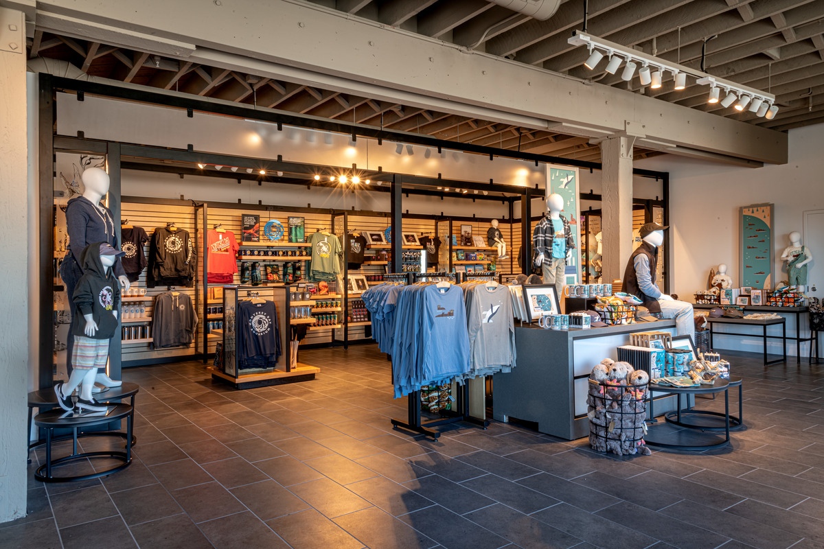 Wide view of the 585 store showing products like tshirts, art, bags