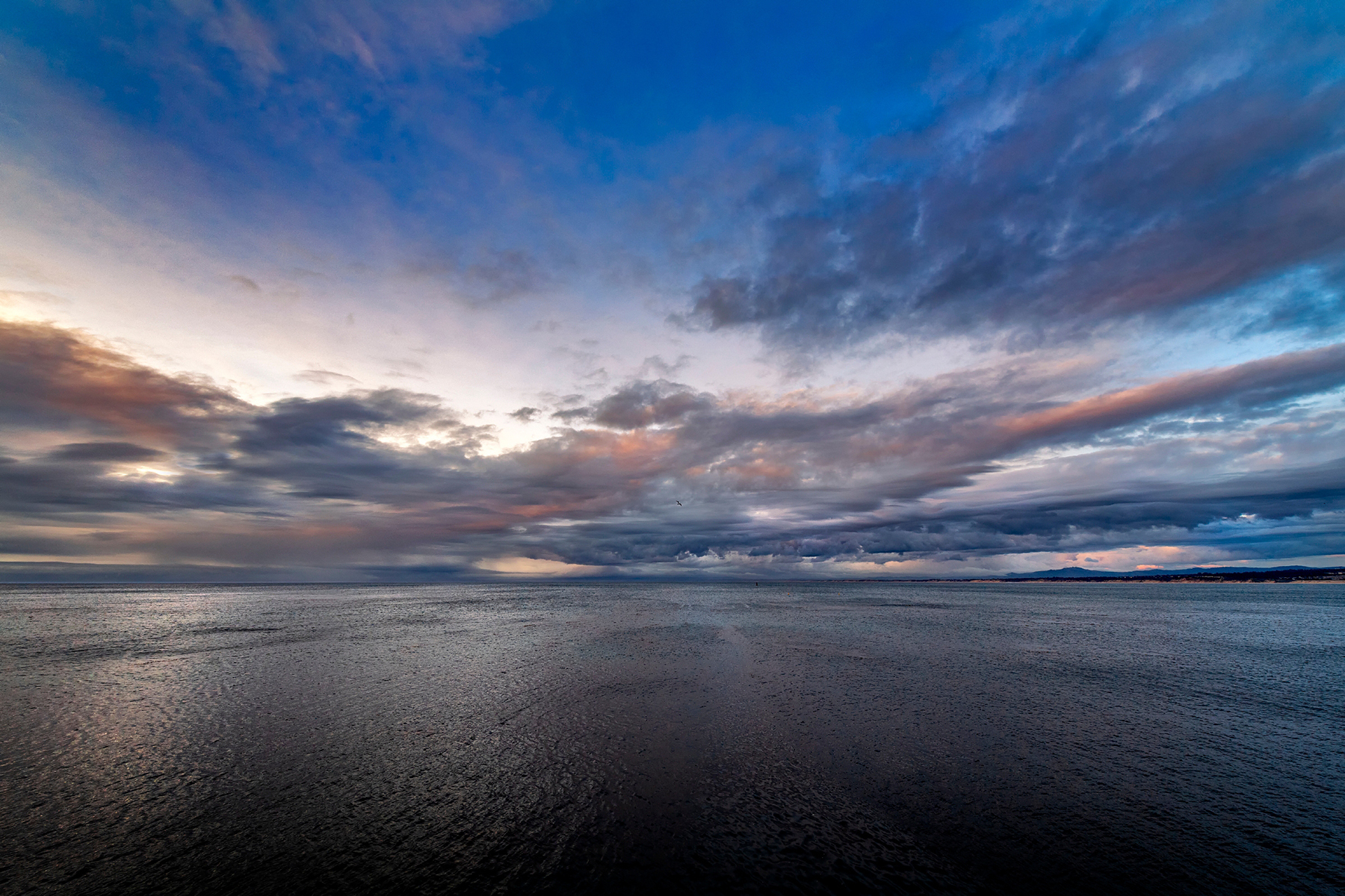View of the sunset over Monterey Bay from the back decks of the Monterey Bay Aquarium.