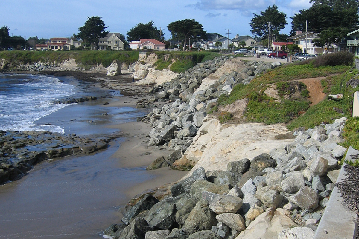 Riprap sinking into sandy beach along Westcliff Drive, Santa Cruz