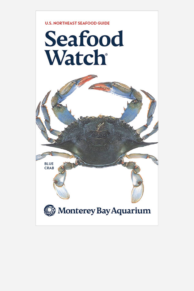 Cover of the U.S. Northeast Seafood Guide with an illustrated blue crab and the Monterey Bay Aquarium logo. Blue crab illustration © Scandposters
