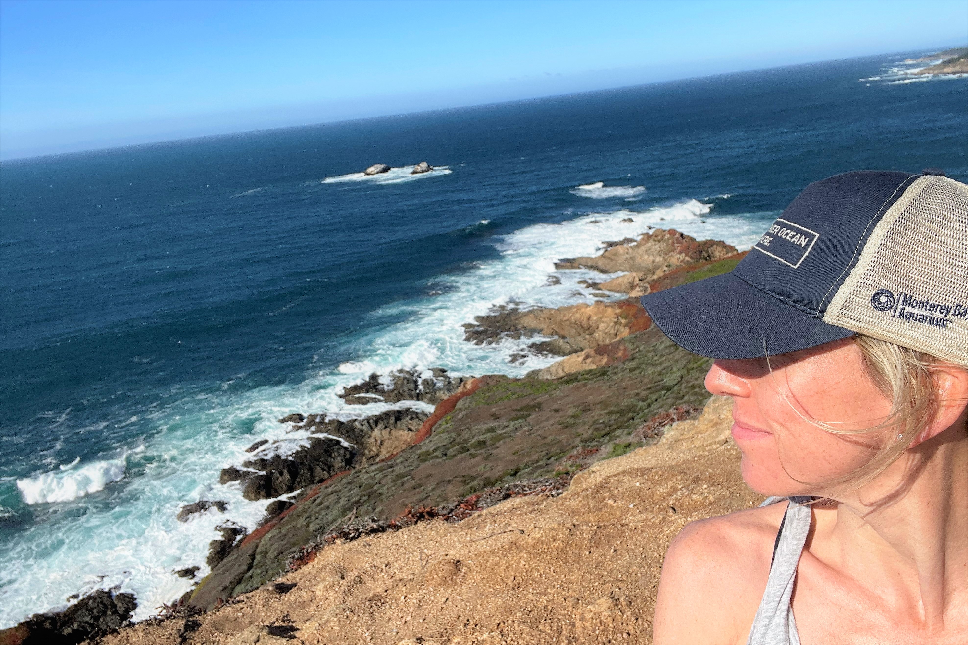 Federal Ocean Policy Senior Manager Eleanore Humphries standing in front of the ocean
