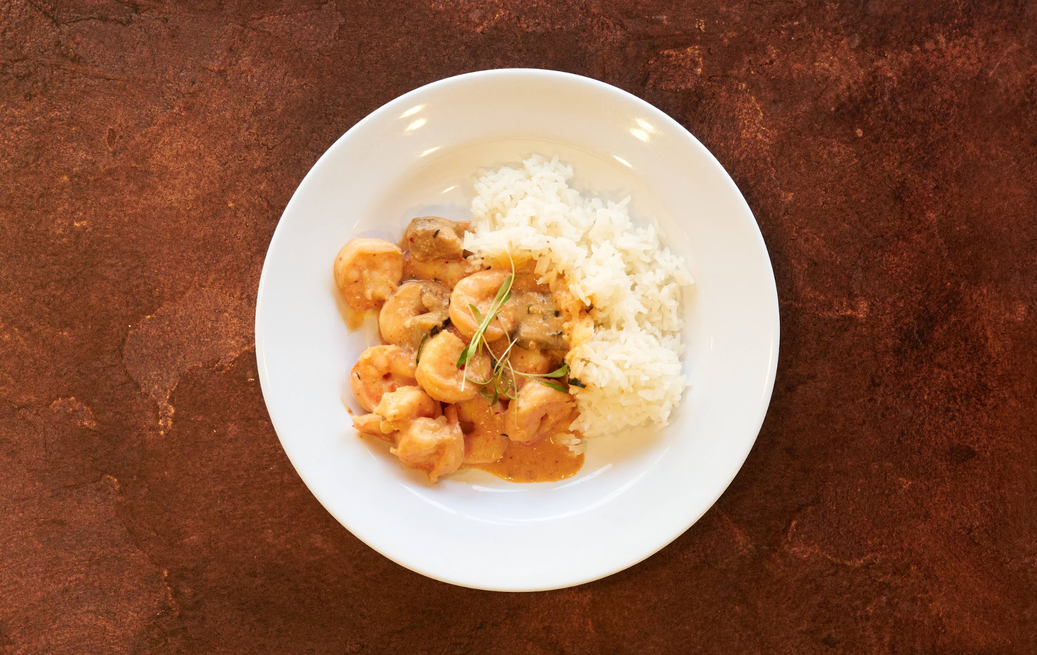 Shrimp and rice in a white bowl