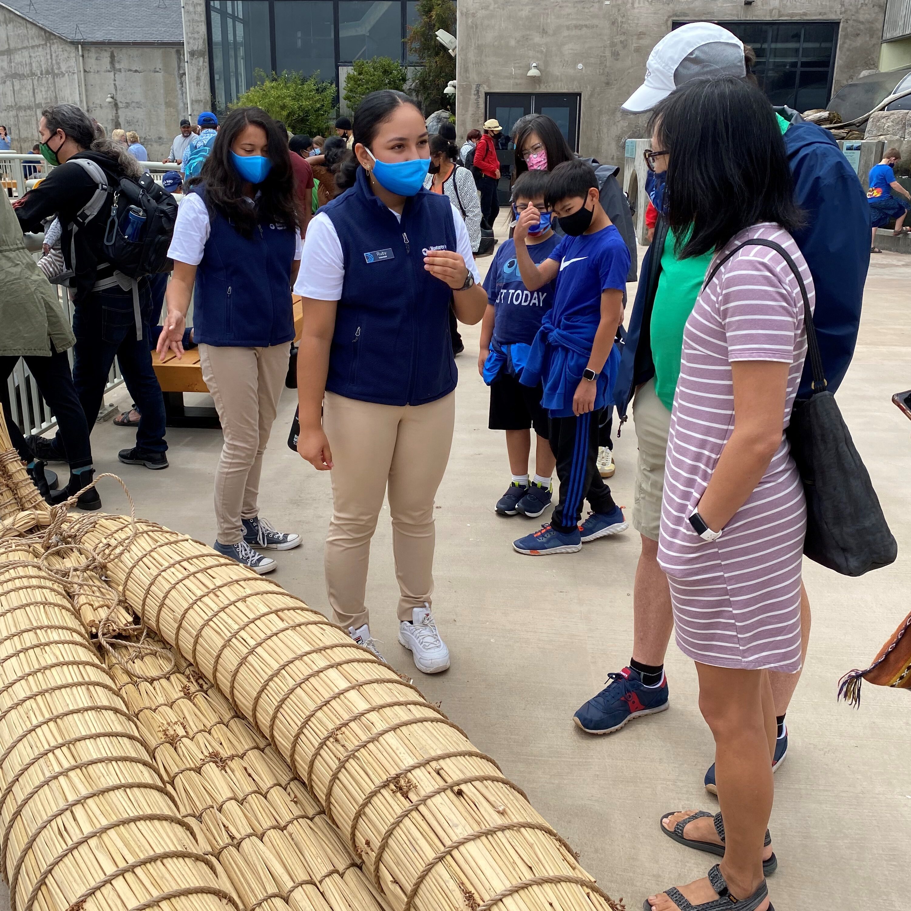 TCL teens interpreting tule canoe for guests on back deck - summer 2021